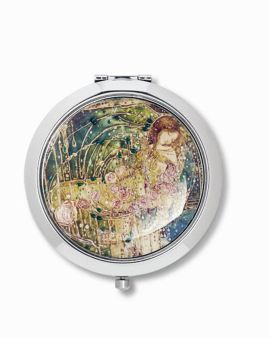 A round compact mirror featuring the 
Sleeping Princess design on top.