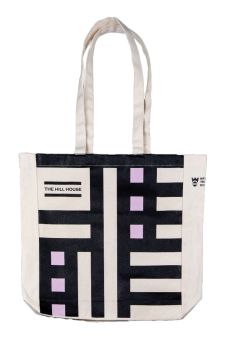 The shopper bag with a long strap, it features a design inspired by the Hill House. Underneath there is text: 'The Hill House.'
