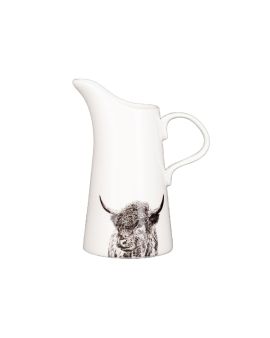 A ceramic jug with a pointed spout and curved handle. There is an illustration of a Highland Cow at the bottom.