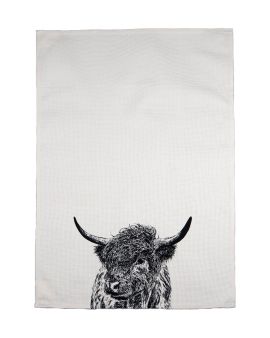 A tea towel with an image of a Highland cow at the bottom in the middle. 