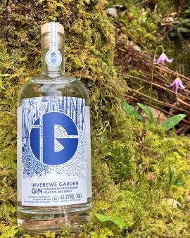 An image of our NTS Inverewe Garden Gin against a tree surrounded by greenery